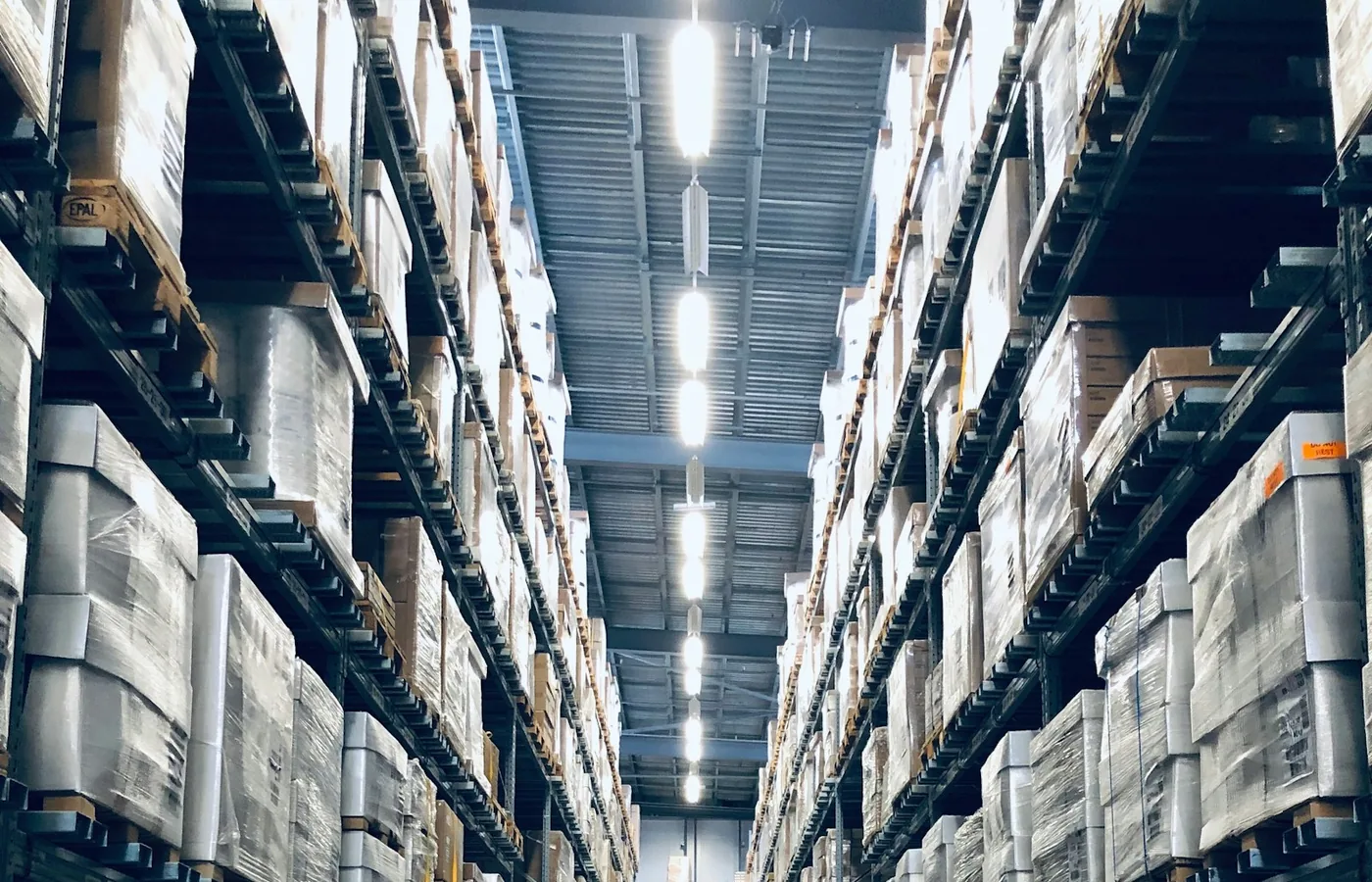Organized warehouse aisle representing structured supplier network visibility